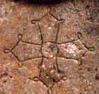 detail of a cross on the stele at Montsegur - an early version of the Cross of Toulouse